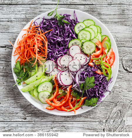 freshvegetablesaladwithredcabbagecucumberradishcarrotssweet