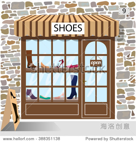 building facade of stone. shoes and boots in the shop window.