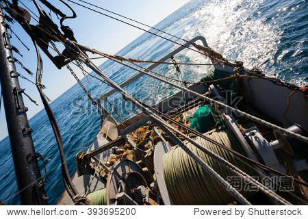 fishing boat fishing by trawl in coastal waters. sea of japan.
