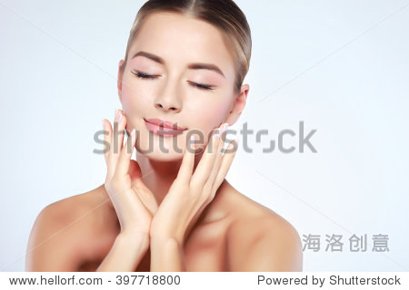 headed young woman with beautiful blue eyes isolated on a light