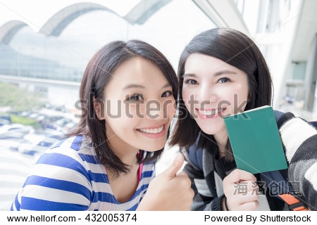 Happy group travel women hold passport and ta