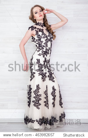portrait of a beautiful girl in a beautiful dress with patterns