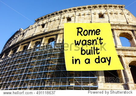 rome wasnt built in a day idiom note affixed on colosseum in