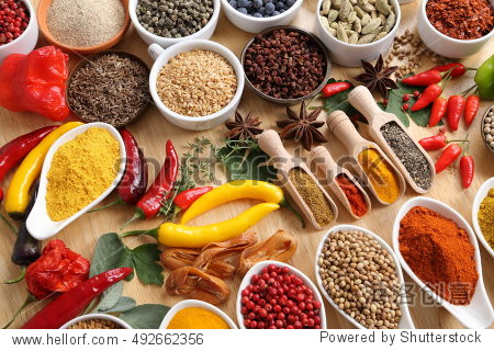 herbs and spices in ceramic bowls.