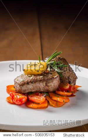 fillet mignon with carrots, cheese and small tomatoes