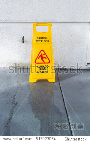 slippery floor surface warning sign and symbol in building, hall