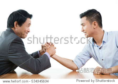 Business Men Arm Wrestling Aggressively