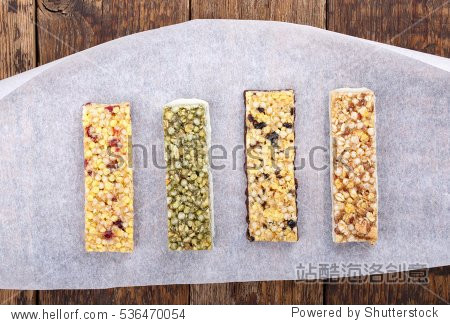 various muesli / granola bars with nuts cereals dried berries.