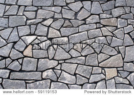 surface of the wall made of stones of irregular shapes.