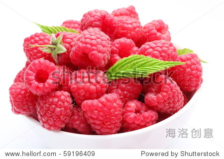 crockery with beautiful ripe raspberries.
