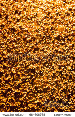 plaster on a wall in gold lighting as a background - 图片素材