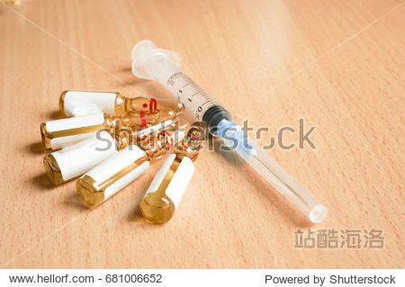syringe and medication in ampoules, injections, capsules and tab