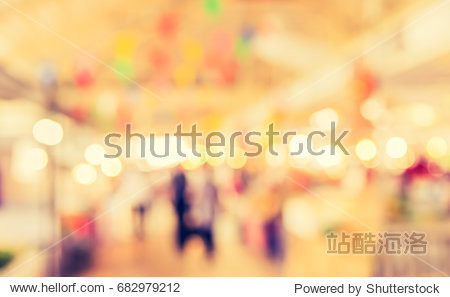 Abstract blur image of Food stall at day market with bokeh for background usage . (vintage tone)