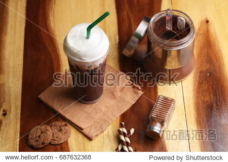 Ice cocoa soft drink on wood floor and topping