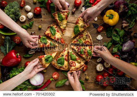 partial view of friends taking homemade pizza slices - 站酷海洛