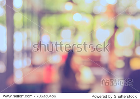 Abstract blur image of coffee shop or restaurant on day time with bokeh for background usage. (vintage tone)