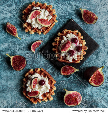overhead still life of belgian biscuit waffles with cottage