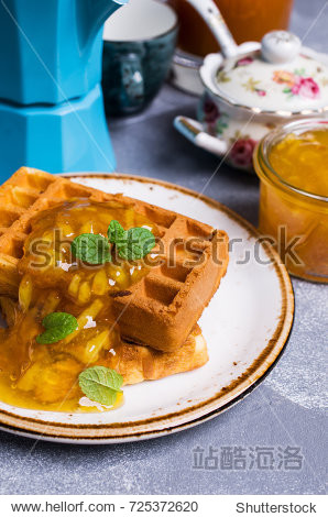 traditional belgian waffles with orange confiture.