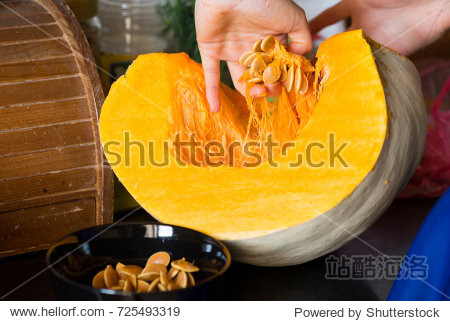 a young girl chef preparing a traditional pumpkin soup, cleaning