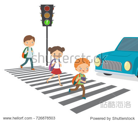 children cross the road to a green traffic light.