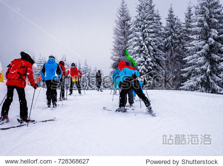 Skiers ride the slopes in the mountains  Christmas holidays