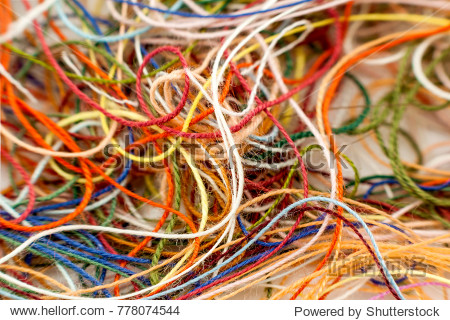 multi-colored tangled colorful needlecraft silk thread rope.