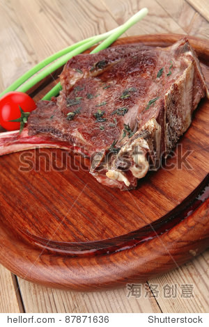 served main course: grilled pork ribs served with green chives
