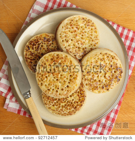 plate of hot buttered crumpets