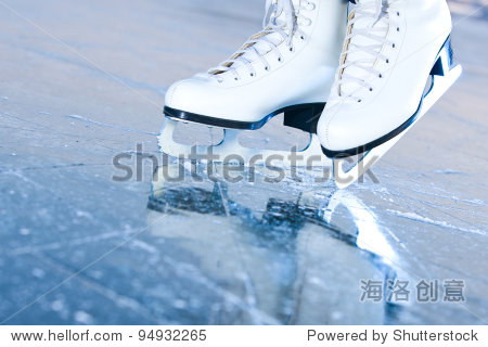 Tilted blue version  ice skates with reflection
