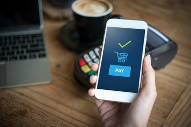hand and mobile payment in coffee shop ,online shopping concept
