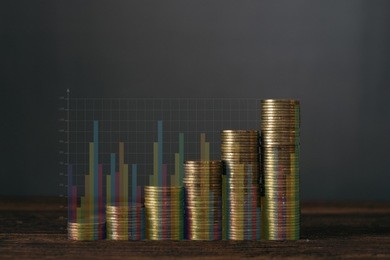 double exposure step of coins stacks on wooden table with financial graph and copy space for business and financial concept idea.