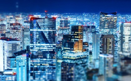 asia business concept for real estate & corporate construction - panoramic modern city skyline view with neon night in roppongi hill, tokyo, japan. miniature tilt-shift effect