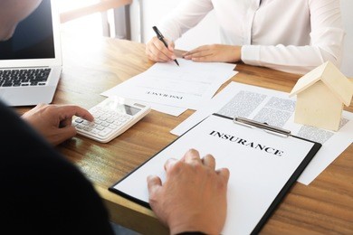 insurance agent explain consulting with customer to signing the policy form.