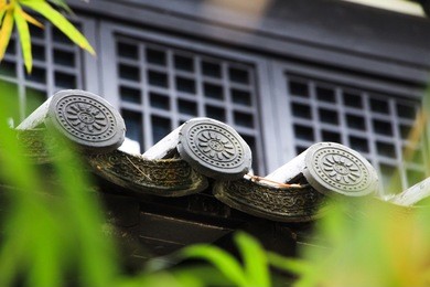 chinese style roof tile covered by bamboo leaves