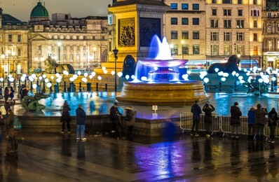 long exporure of illuminated trafalgar square, london, uk