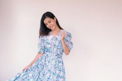 fashion portrait of young cute asian woman wearing vintage blue dress 