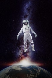 astronaut in space, in zero gravity near planet earth. elements of this image furnished by nasa.