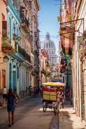 havana, cuba, el capitolio seen from a narrow street