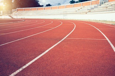 red running track lines in stadium.