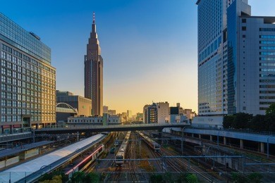 cityscape around railway shinjuku station with ntt docomo yoyogi building, shinjuku is one of tokyo's business districts. there are many skyscrapers, such as hotels, office buildings.