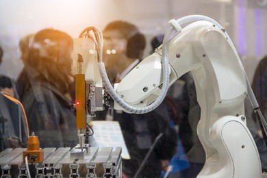 industry 4.0 robot concept .the robot arm is working smartly in the production department, the future factory.
