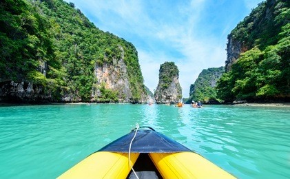 tourist are visiting by flatwater canoeing. located in ao phang nga national park, phuket, thailand.