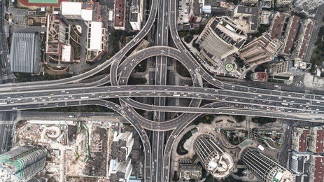 aerial view of highway and overpass in city on a cloudy day