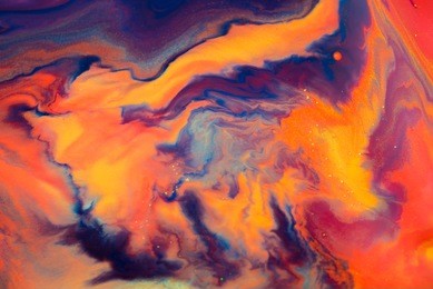 colorful paint background in concept fantasy luxury texture. colors dropped into liquid and photographed while in motion. abstract composition.