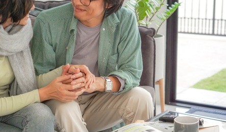 couple love and good new concept - asian lovely couple in glad feeling on sofa in living room  and copy space. use for love and couple artwort.