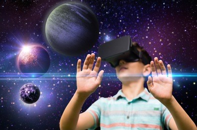 childhood, augmented reality, technology and people concept - boy with virtual headset or 3d glasses playing game outdoors at summer