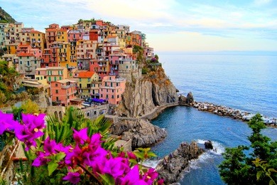 village of manarola, on the cinque terre coast of italy with flowers