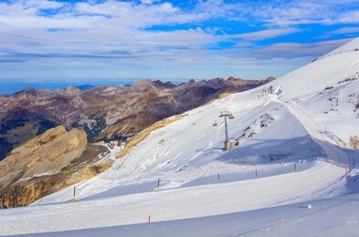 a wintertime view from mt. titlis in switzerland. the titlis is a mountain, located on the border between the swiss cantons of obwalden and bern, it is usually accessed from the town of engelberg.