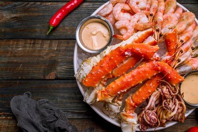 platter of shrimp, king crab and squid on the ice