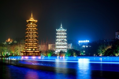landscape of sun and moon pagodas, shan lake, guilin, china.